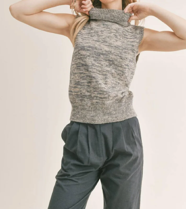 Create a timeless wardrobe with fashionable pieces   Shelby Turtleneck Vest In Navy Multi