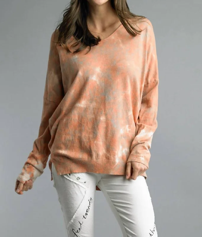 Refresh your wardrobe with trendy women’s apparel   Tie Dye V Neck Tunic Sweater In Pumpkin