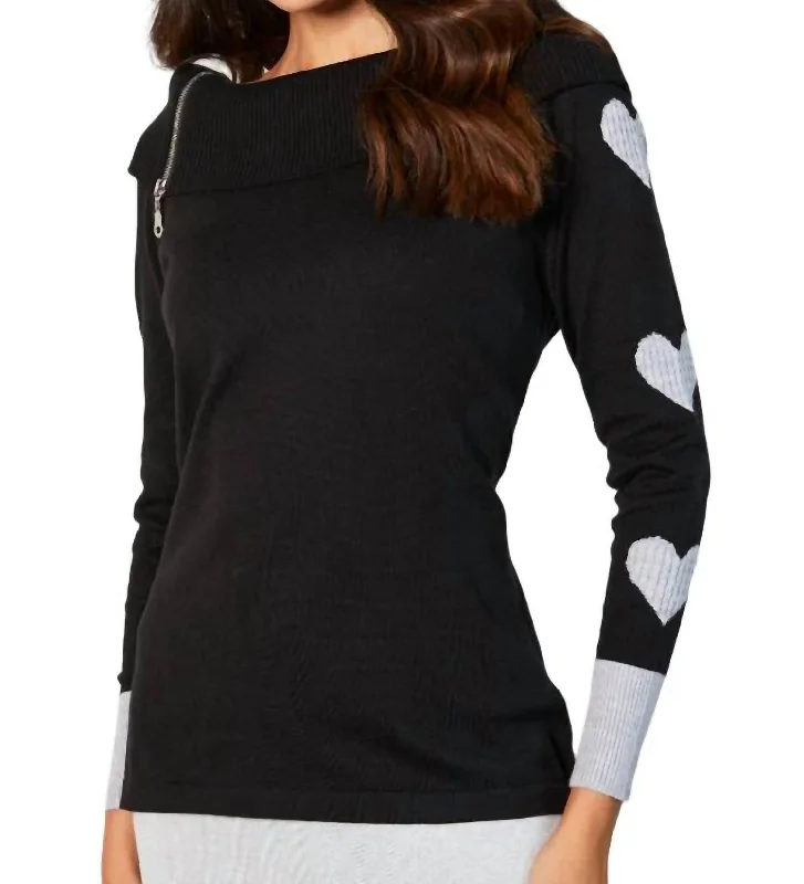 Iconic women’s outfits that never go out of style   Zip Ribbed Cowl Neck With Heart Detail In Black/slate